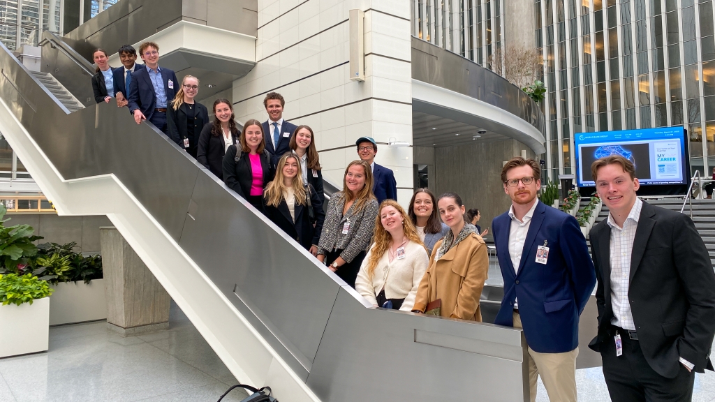 Students posing on a staircase